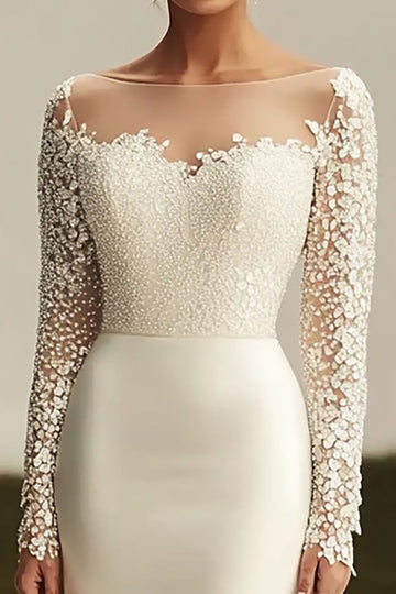 Robe de mariée en dentelle à manches longues en satin ivoire avec traîne